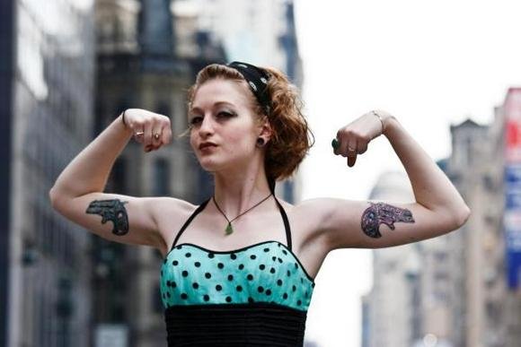 2 Guns tattoos on Biceps