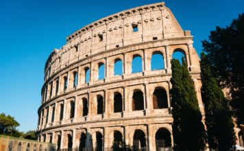 Brief Guide for Taking Amazing Travel Photos in Crowded Tourist Locations Colosseum in Rome, Italy.